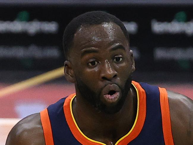 CHARLOTTE, NORTH CAROLINA - FEBRUARY 20: Draymond Green #23 of the Golden State Warriors looks to pass during the second quarter of their game against the Charlotte Hornets at Spectrum Center on February 20, 2021 in Charlotte, North Carolina. NOTE TO USER: User expressly acknowledges and agrees that, by downloading and or using this photograph, User is consenting to the terms and conditions of the Getty Images License Agreement. (Photo by Jared C. Tilton/Getty Images)