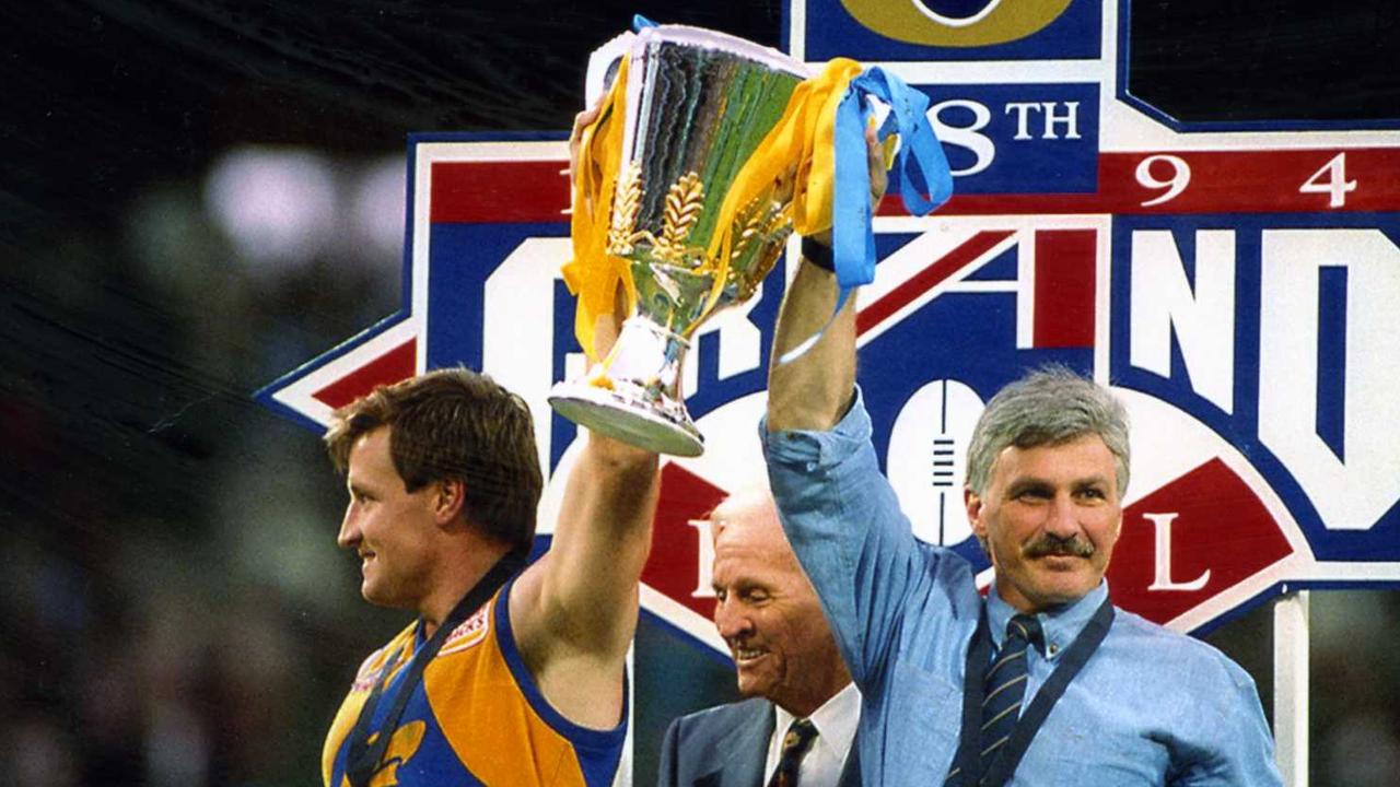 Eagles captain John Worsfold holds up the 1994 premiership cup with Mick Malthouse.