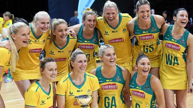 Clare McMeniman holds the trophy as the Australian Diamonds celebrate their series defeat of New Zealand in the Constellation Cup. Many of the same players will be hoping to be in the team for the 2018 Commonwealth Games. Picture: ROSS SETFORD