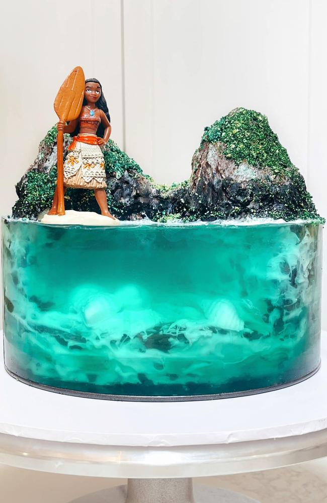 A mum made this impressive Moana cake using three Woolies mud cakes. Picture: Facebook/Woolies/Coles Mudcake Hacks