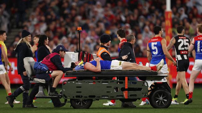 Angus Brayshaw of the Demons is stretchered off against Collingwood last week Photo: Michael Klein.