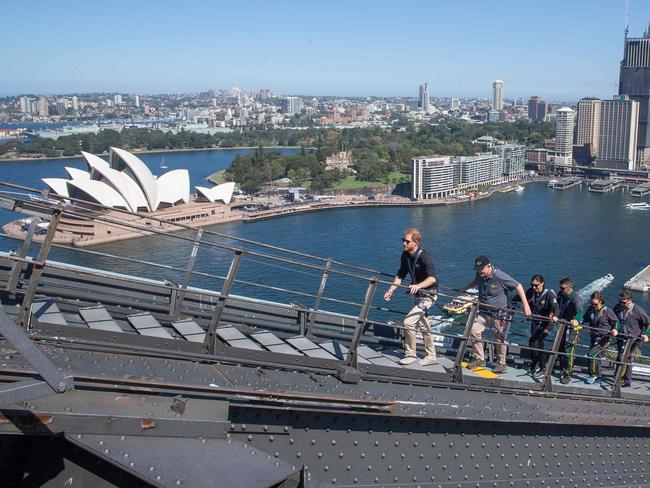 The Duke of Sussex and Invictus Games representatives take in the view. Picture: Steve Christo