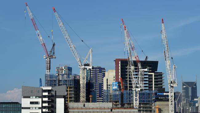 Cranes over buildings in Melbourne’s Docklands. In 2017 and 2018 an avalanche of Melbourne apartments that were bought ‘off the plan’ will come up for settlement. Picture: Jay Town