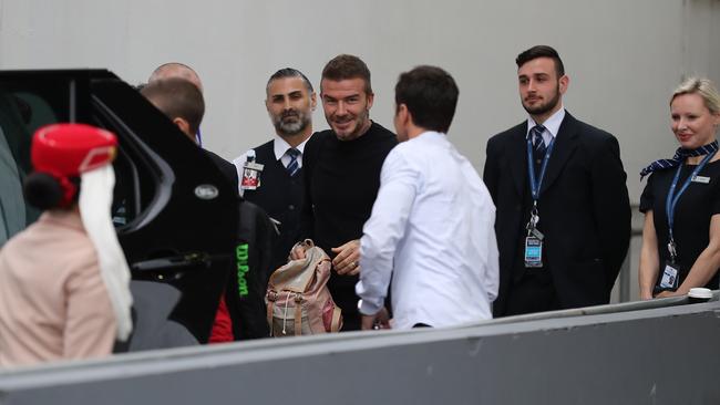 David Beckham was all smiles after a long flight from London to Sydney. Picture: David Swift