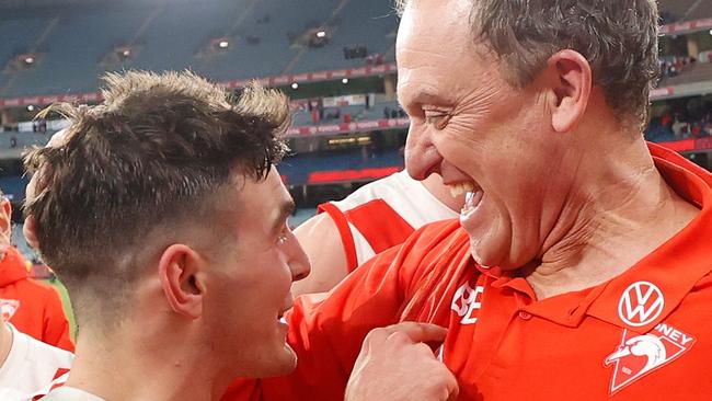 Swans coach John Longmire, pictured celebrating the Melbourne win with Errol Gulden, has a strong rapport with his players. Picture: Getty Images