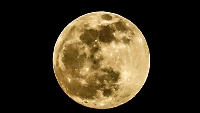 The super flower blood moon appears over Gaza City, May 15, 2022.  (Photo by Sameh Rahmi/NurPhoto via Getty Images)