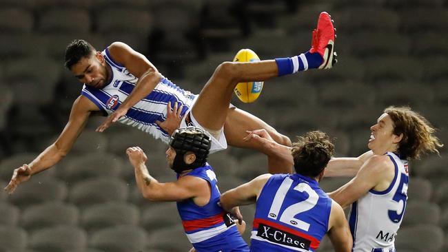 Tarryn Thomas of the Kangaroos attempts a high mark over Caleb Daniel of the Bulldogs during the 2020 AFL Round 05 match between the Western Bulldogs and the North Melbourne Kangaroos at Marvel Stadium. (Photo by Michael Willson/AFL Photos via Getty Images)