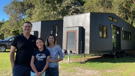 Dr Dang Nguyen with her family in their tiny home that they can pack up and move if any form of disaster threatens them.