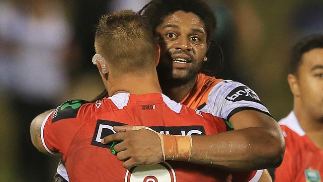 Jamal Idris hugs Tariq Simms after the Dragons v  Tigers trial game.