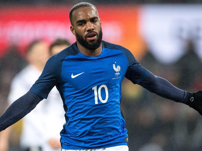 TOPSHOT - France's forward Alexandre Lacazette celebrates scoring the 1-2 during the international friendly football match Germany against France in Cologne on November 14, 2017. / AFP PHOTO / dpa / Marius Becker / Germany OUT