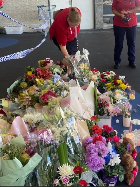 Flowers left at the scene on Monday.