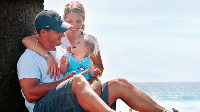 A baby Sam with dad Ben and mum Kylie in 2003. He’s added a bit of size since this photo.