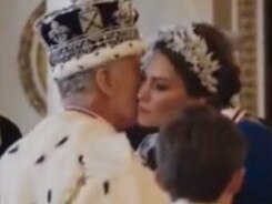 Kate kisses her father-in-law on the cheek...