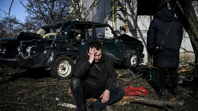 – A man sits outside his destroyed building after bombings on the eastern Ukraine town of Chuguiv. Picture: Aris Messinis / AFP