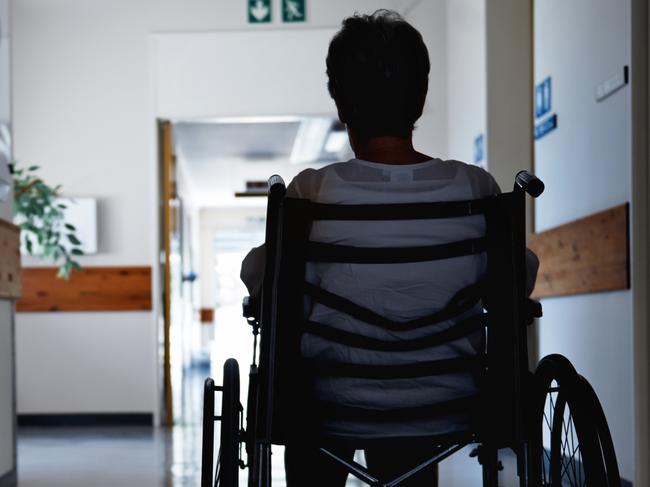 BAD AGED CARE:   Rearview shot of a senior woman sitting in a wheelchair