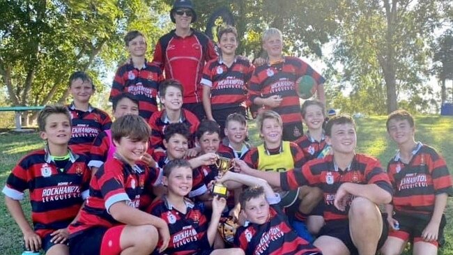 Coach Gareth Saunders with the Rockhampton Grammar Primary rugby league team, which claimed the CQ Capras Challenge Jake Granville Cup for the first time.