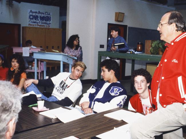 (l-r) Tiffani Thiessen as Kelly Kapowski, Mark-Paul Gosselaar as Zachary 'Zack' Morris, Mario Lopez as Albert Clifford "A.C.' Slater, Dustin Diamond as Screech Powers and Executive Producer Peter Engel at a table read. Picture: Supplied