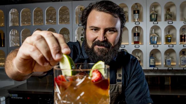 Kurt Mellross putting the finishing touches on a cocktail at The Gin Parlour and Infusion Bar, Miami Marketta. Picture: Jerad Williams