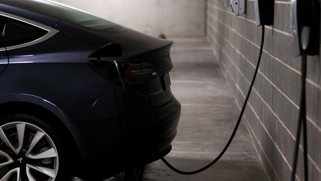 A Tesla Model Y charges at a EV charge station in Lane Cove,