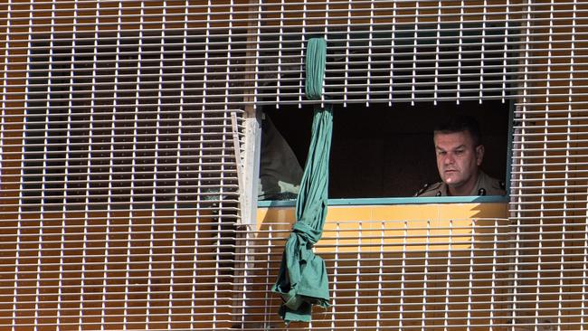 Corrections Commissioner Matthew Varley assesses the scene after two prisoners allegedly escaped custody from the Darwin watch house. Picture: Pema Tamang Pakhrin