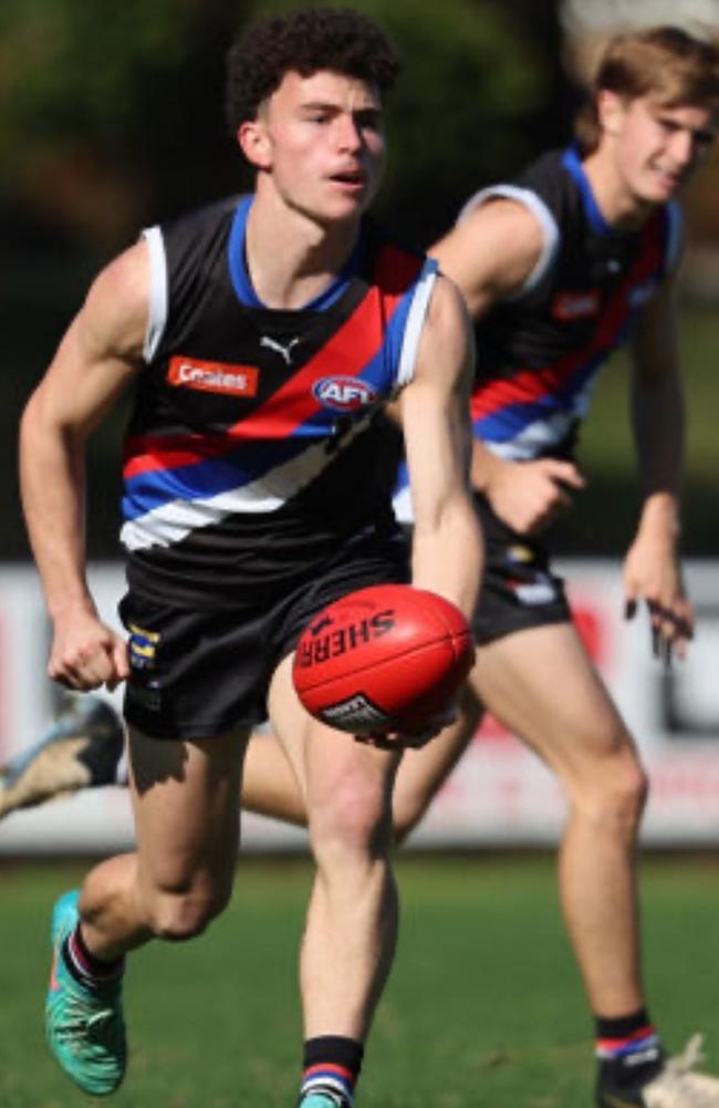 Massimo Raso gets away a handball for the Western Jets.