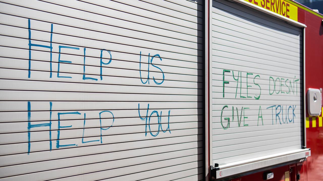 Firefighters have written slogans on their trucks calling on the NT government to step up in their pay negotiation with the United Workers Union. Picture: Pema Tamang Pakhrin