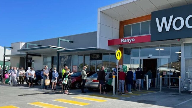 Long lines of people waiting outside a Banyo supermarket. Photo: Facebook