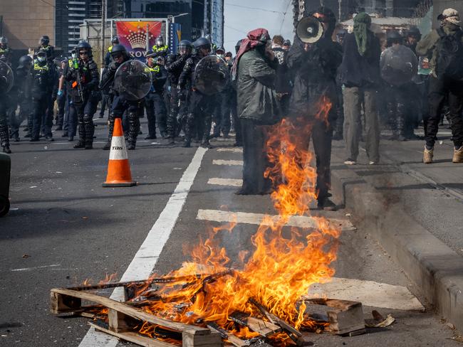 Anti-war activists protest at the Land Forces 2024 International Land Defence Exposition at the Melbourne Convention and Exhibition Centre. Picture: Jake Nowakowski