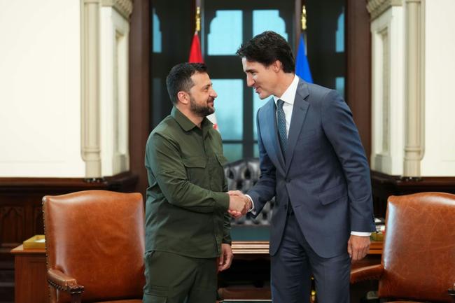 Ukrainian President Volodymyr Zelensky shakes hands with Canadian Prime Minister Justin Trudeau at Parliament Hill in Ottawa, Canada