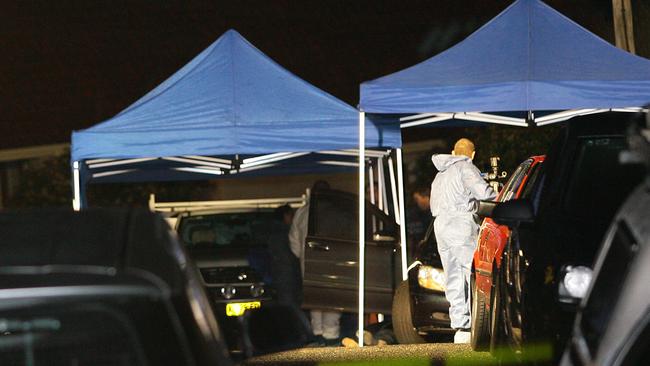 Forensic officers and police outside the Cranbrook Ave, Cremorne, property following the murder.