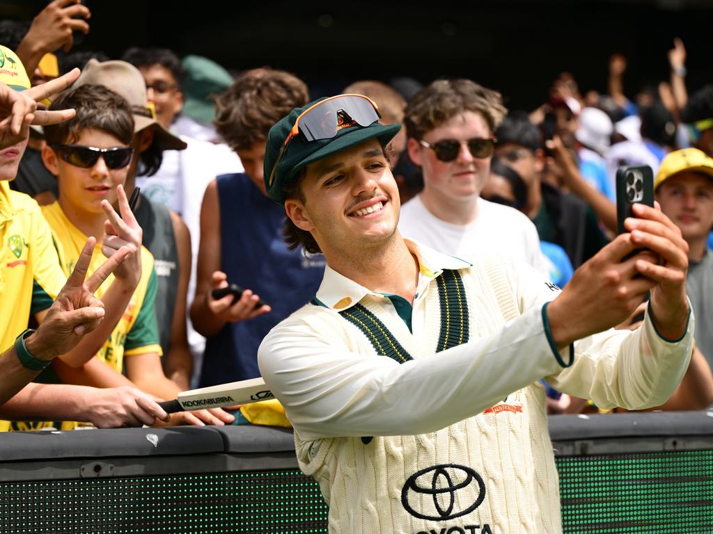 Sam Konstas takes selfies with young fans. Picture: Quinn Rooney/Getty Images