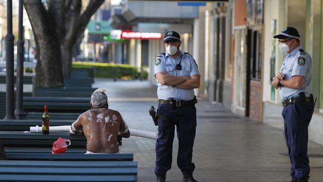 Police talk to a man in Dubbo’s main street on September 1. Picture: NCA Newswire / Dean Marzolla