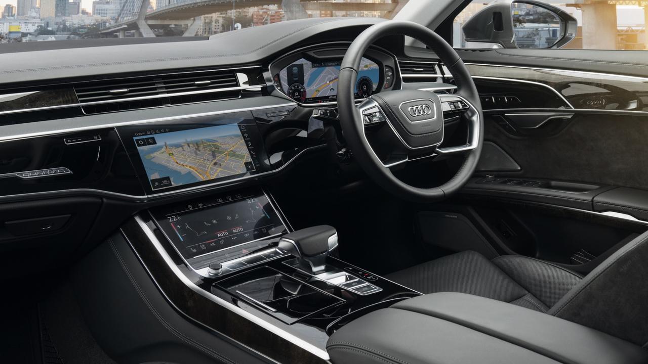 Wood inlays give the A8 a conservative look despite the screens and the powered air vents/