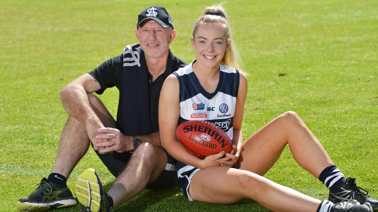 Former South Adelaide player Andrew Brockhurst and his daughter Emily, Saturday, March 9, 2019. South Adelaide had its first daughter of a past player make her debut in the SANFLW last week. (AAP Image/Brenton Edwards)