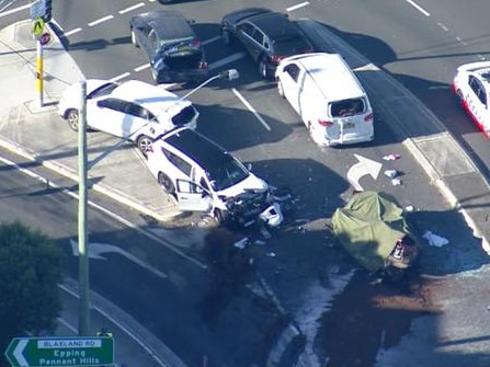 A number of vehicles had a lot of damage from the crash, with police covering up the wreckage of one. Photo: 7