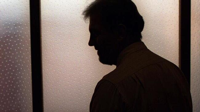 Generic image. Silhouette of a man (parent of) a sex abuse victim in an office. wrongly accused of touching young girl. Child sexual abuse. sex crime incest paedophilia.