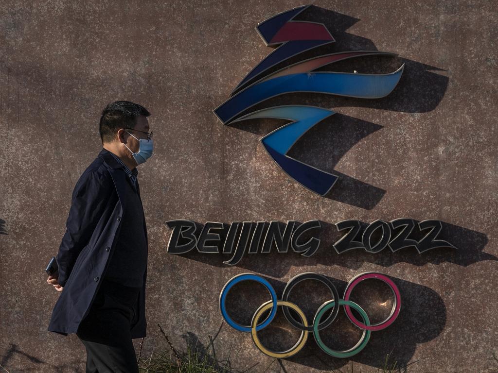 A visitor walks by the logo for the Beijing 2022 Winter Olympics at Shougang. Picture: Kevin Frayer/Getty Images
