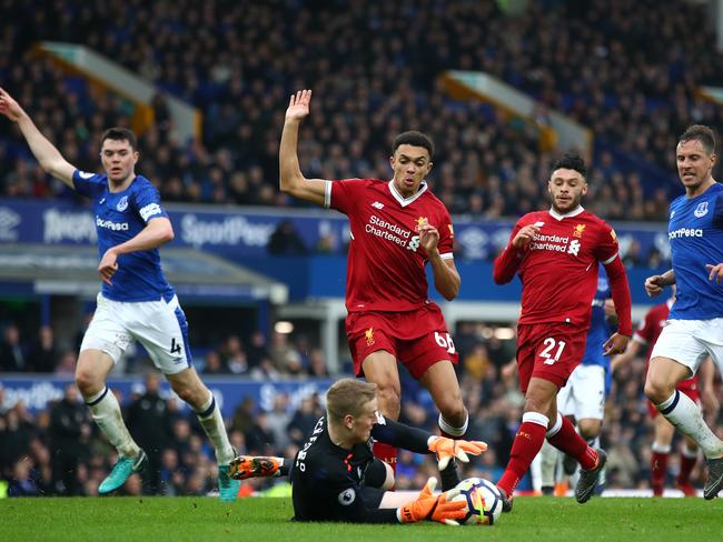 Trent Alexander-Arnold is challenged by Jordan Pickford. (Photo by Julian Finney/Getty Images)