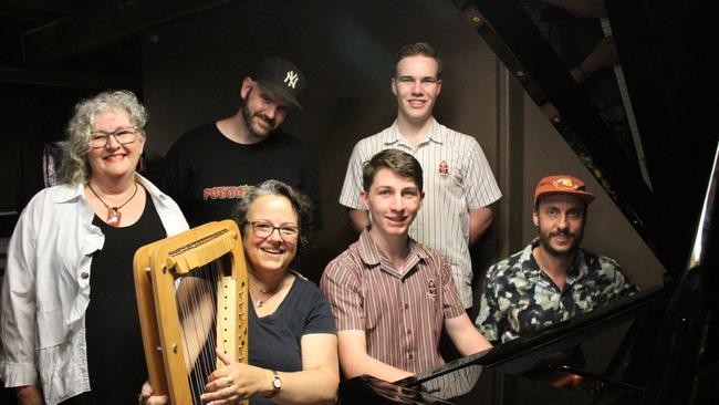 Sally Westaway, Wendy Pierson, Dan the Underdog, Thomas van der Geest-Hester, Paddy van der Geest-Hester, and Dave Crowe with the brand new Yamaha C7 grand piano at Araluen Arts Centre. Picture: Gera Kazakov