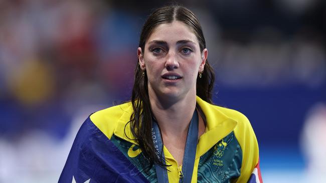 NANTERRE, FRANCE - AUGUST 04: Silver Medalist Meg Harris of Team Australia wears the national flag of Australia following the Swimming medal ceremony after the Women's 50m Freestyle Final on day nine of the Olympic Games Paris 2024 at Paris La Defense Arena on August 04, 2024 in Nanterre, France. (Photo by Quinn Rooney/Getty Images)