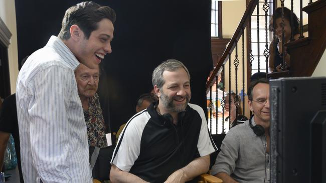 Pete Davidson and director Judd Apatow with crew members on the set of The King of Staten Island.