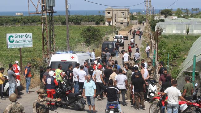 Lebanese soldiers, an ambulance and civilians gather near the site of Israeli bombardment in the village of Zahrani on May 17, 2024, in southern Lebanon. Picture: Mahmoud Zayyat/AFP