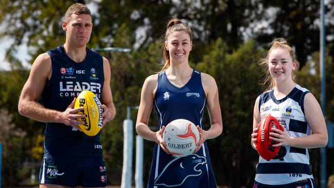 South Adelaide netballer Eilish McKay between footballers Alex Cailotto (L) and Jaslynne Smith. The Premier League netball club, formally named Woods Panthers, will become South Adelaide after joining forces with the SANFL club.