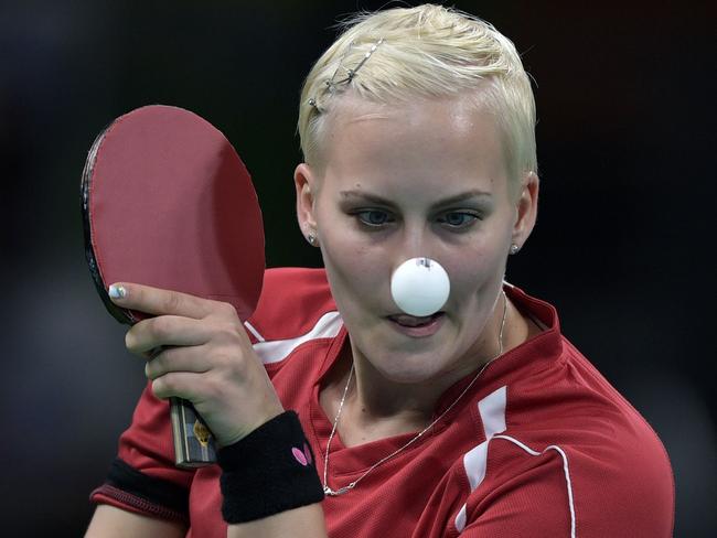 Slovakia's Barbora Balazova eyes the ball in her women's singles qualification round table tennis match at the Riocentro venue during the Rio 2016 Olympic Games in Rio de Janeiro on August 6, 2016. / AFP PHOTO / Juan Mabromata