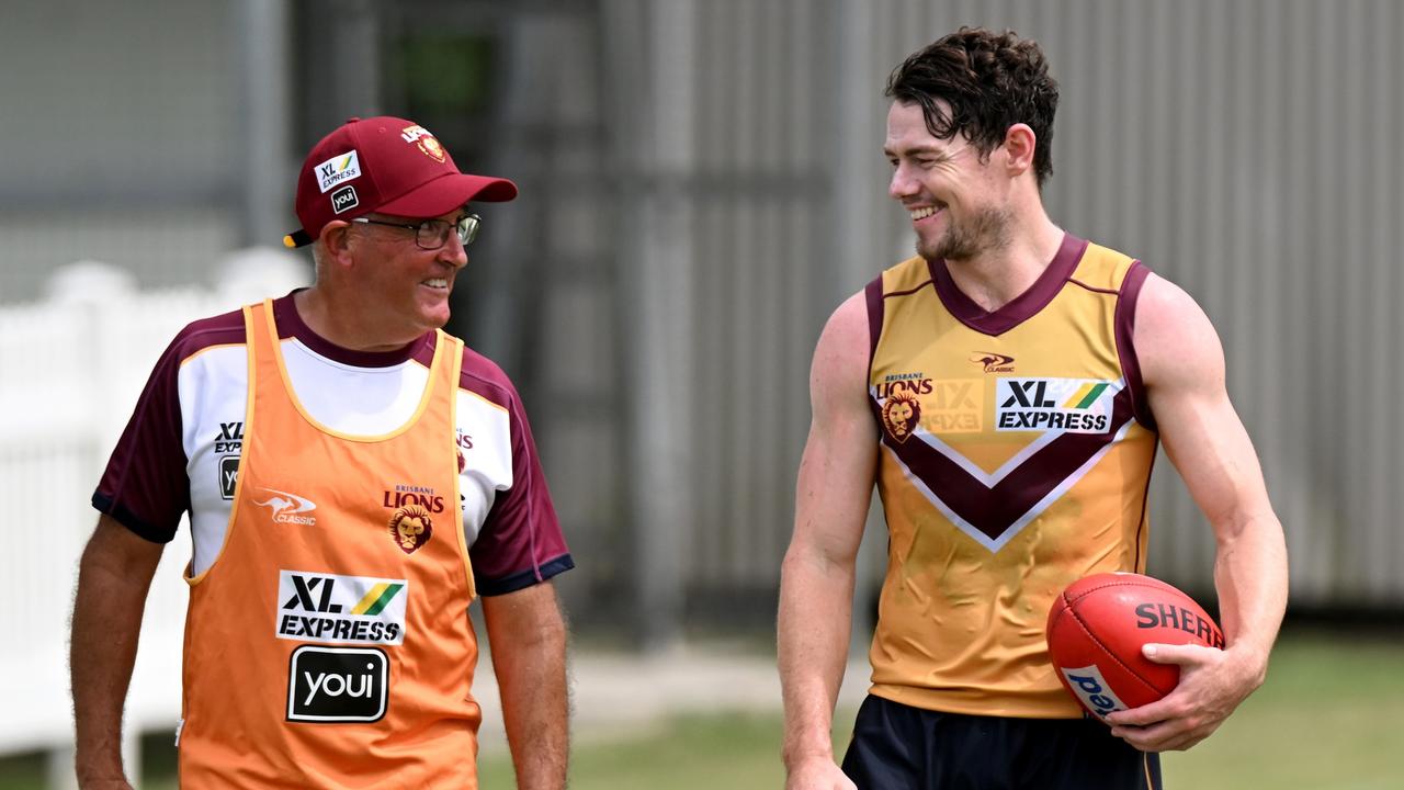 Lions coach Chris Fagan chats with Brisbane star Lachie Neale at training. Picture: Bradley Kanaris/Getty Images