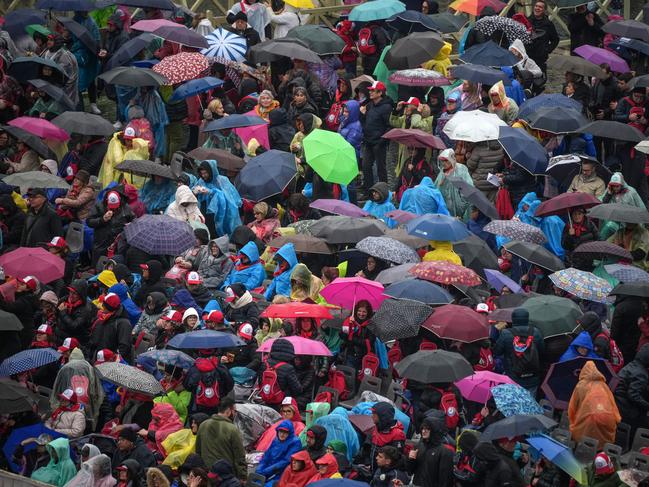 Faithful brave the rain and take part in the Holy Mass for the Jubilee of Pilgrims of the Archdiocese of Naples in Saint Peter’s Square ahead of the Pope’s release from hospital. Picture: Getty Images