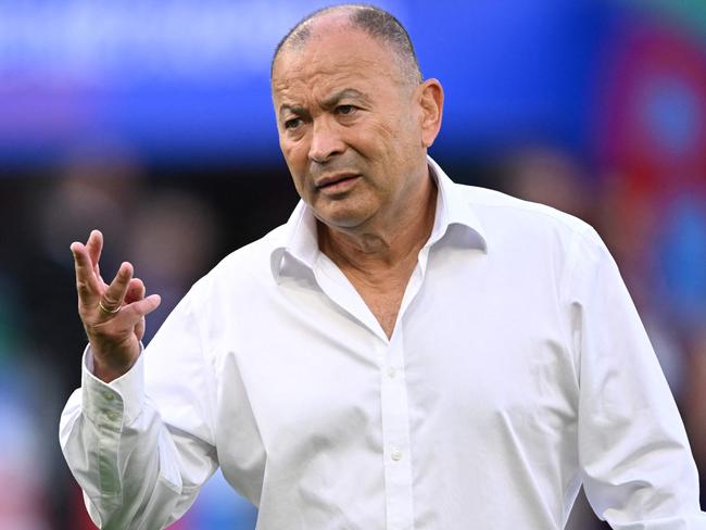 Australia's head coach Eddie Jones leads warm up prior to the   France 2023 Rugby World Cup Pool C match between Australia and Portugal at Stade Geoffroy-Guichard in Saint-Etienne, south-eastern France, on October 1, 2023. (Photo by SEBASTIEN BOZON / AFP)