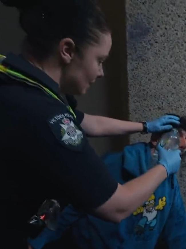 Denino receiving first aid by Victorian Police. Picture: X