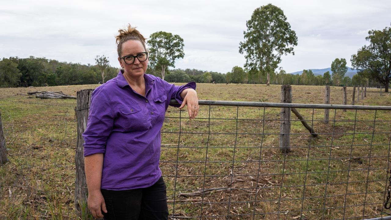 Widgee cattle farmer Kris Janke stands outside the gate of the paddock of one of the proposed transmission line routes. Picture: Christine Schindler