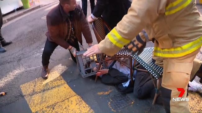 Jase Shore is seen holding the crate over Ney’s head during a citizen’s arrest. Picture: 7 News